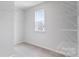 Bright walk-in closet offering ample storage space with shelving and a window at 3535 Cramer Creek Dr, Gastonia, NC 28056