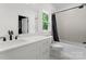 Bright bathroom featuring white vanity, modern fixtures, and a shower-tub combination at 3933 Ayrshire Pl, Charlotte, NC 28210