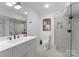 Clean, modern bathroom features a glass shower, white vanity, and contemporary fixtures at 3933 Ayrshire Pl, Charlotte, NC 28210