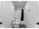 Compact bathroom featuring a shower-tub combination with modern fixtures and ample lighting at 3933 Ayrshire Pl, Charlotte, NC 28210