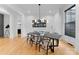 Dining room with modern chandelier and seating for six at 3933 Ayrshire Pl, Charlotte, NC 28210