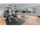 Spacious gym area with hardwood flooring, natural light, and workout equipment at 3933 Ayrshire Pl, Charlotte, NC 28210