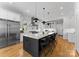 Spacious kitchen features a large island with seating, stainless steel appliances, and modern finishes at 3933 Ayrshire Pl, Charlotte, NC 28210