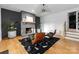 Stylish living room boasts a brick fireplace, hardwood floors, and modern decor at 3933 Ayrshire Pl, Charlotte, NC 28210
