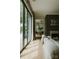 Bright living room with hardwood floors and large sliding glass doors to the patio at 3933 Ayrshire Pl, Charlotte, NC 28210