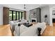 Cozy living room featuring a fireplace, spacious seating area, hardwood floors, and patio views, perfect for relaxing at 3933 Ayrshire Pl, Charlotte, NC 28210