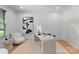 Bright home office with modern desk, neutral palette, hardwood floors, and unique artwork at 3933 Ayrshire Pl, Charlotte, NC 28210