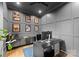 Home office with modern gray walls, hardwood flooring, stylish desk, and elegant décor, ideal for productivity at 3933 Ayrshire Pl, Charlotte, NC 28210