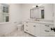 Bathroom with vanity, marble countertop, rectangular mirror and white marble-look floor at 4021 Nettie Ct # 7, Charlotte, NC 28211
