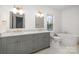 Elegant bathroom featuring double vanity with modern fixtures, freestanding tub, and marble tile flooring at 4021 Nettie Ct # 7, Charlotte, NC 28211