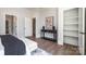 Bedroom featuring an elegant console table, decor items, and a view to a built-in shelving unit at 4021 Nettie Ct # 7, Charlotte, NC 28211