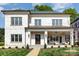 Beautiful two-story brick home with manicured lawn, covered porch, and neutral color palette at 4021 Nettie Ct # 7, Charlotte, NC 28211