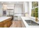Open concept kitchen with stainless steel appliances and large island at 4021 Nettie Ct # 7, Charlotte, NC 28211