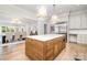 Spacious kitchen featuring wood island, marble countertops, and dining area at 4021 Nettie Ct # 7, Charlotte, NC 28211