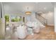 Spacious living room with fireplace, stairs, and comfortable seating arrangement at 4021 Nettie Ct # 7, Charlotte, NC 28211
