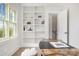 Bright home office with custom built-in shelving, modern desk, and a window overlooking the yard at 4021 Nettie Ct # 7, Charlotte, NC 28211