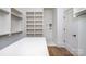 Spacious walk-in closet with ample shelving, storage, and a functional layout for organization at 4021 Nettie Ct # 7, Charlotte, NC 28211