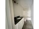 Bathroom features a dark countertop, white cabinetry, and a shower-tub combo at 4044 Hurley Walters Rd, Lancaster, SC 29720