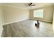 Sun-filled bedroom features modern flooring, fresh paint, neutral decor, and dual windows at 4044 Hurley Walters Rd, Lancaster, SC 29720