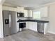 Modern kitchen featuring stainless steel appliances, white cabinetry, and dark countertops at 4044 Hurley Walters Rd, Lancaster, SC 29720