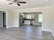 Open-concept living area showcasing seamless flow into a modern kitchen with stainless steel appliances at 4044 Hurley Walters Rd, Lancaster, SC 29720