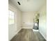 Utility room features a new water heater, wood-style flooring, and access door to backyard at 4044 Hurley Walters Rd, Lancaster, SC 29720