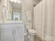 Bathroom featuring modern vanity, toilet, and shower with curtain at 520 Sedgefield Park Dr, Charlotte, NC 28203