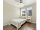 Bedroom featuring a bed, hardwood floors, modern ceiling fan and large windows at 520 Sedgefield Park Dr, Charlotte, NC 28203