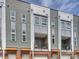 Contemporary townhome showcases modern architecture, private balconies, and individual garages for convenient urban living at 520 Sedgefield Park Dr, Charlotte, NC 28203