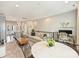 Open-concept living room and kitchen with modern decor, stainless steel appliances, and comfortable seating at 520 Sedgefield Park Dr, Charlotte, NC 28203