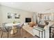 Bright, open-concept living room with stainless appliances, dining area, and comfortable seating for entertaining at 520 Sedgefield Park Dr, Charlotte, NC 28203