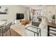 Inviting open-concept living room showcasing a modern kitchen and comfortable dining area with wood flooring at 520 Sedgefield Park Dr, Charlotte, NC 28203