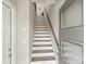Bright entryway staircase with wood and white risers leads up to the next level of the home at 520 Sedgefield Park Dr, Charlotte, NC 28203