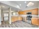 Modern kitchen featuring stainless steel appliances, ample counter space, and sleek wood floors at 5206 Fire Water Ln, Fort Mill, SC 29707