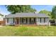 Charming one-story home with a welcoming front porch and a well-maintained lawn at 6915 Norchester Ct, Charlotte, NC 28227