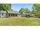 Street view of a charming home with a covered porch and well-manicured lawn at 6915 Norchester Ct, Charlotte, NC 28227