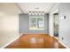 Bright dining area boasts hardwood floors and modern lighting fixture at 6915 Norchester Ct, Charlotte, NC 28227