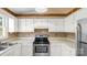Cozy kitchen area with wooden cabinets and modern stainless steel appliances at 6915 Norchester Ct, Charlotte, NC 28227