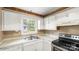 Kitchen features a window over the sink and modern appliances at 6915 Norchester Ct, Charlotte, NC 28227