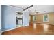 Open floor plan with hardwood floors, connecting the living and kitchen areas at 6915 Norchester Ct, Charlotte, NC 28227