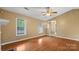 Hardwood floors highlight the ample space and natural light in this living room at 6915 Norchester Ct, Charlotte, NC 28227