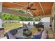 Relaxing outdoor living space featuring a covered patio, comfortable seating, and a well-maintained backyard at 79115 Ridgehaven Rd, Lancaster, SC 29720