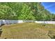 Expansive backyard with a swing set and a pristine white fence bordering the property at 79115 Ridgehaven Rd, Lancaster, SC 29720