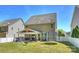 View of the home's backyard with a covered patio, play set and trampoline at 79115 Ridgehaven Rd, Lancaster, SC 29720