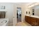 Beautifully appointed bathroom with double sinks and a tub, bathed in natural light at 79115 Ridgehaven Rd, Lancaster, SC 29720