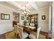 Dining room featuring coffered ceilings, a chandelier, and a china cabinet at 79115 Ridgehaven Rd, Lancaster, SC 29720