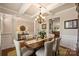 Open-concept dining area with a kitchen view, hardwood floors, and plenty of seating at 79115 Ridgehaven Rd, Lancaster, SC 29720