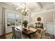 Dining area featuring coffered ceilings, large windows, and hardwood floors at 79115 Ridgehaven Rd, Lancaster, SC 29720
