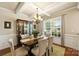 Elegant dining room with coffered ceiling, chandelier, and large window at 79115 Ridgehaven Rd, Lancaster, SC 29720