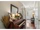 Elegant foyer with hardwood floors, decorative mirror, and a view of the front door at 79115 Ridgehaven Rd, Lancaster, SC 29720